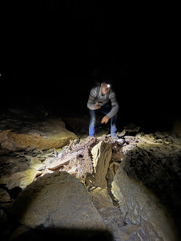 Alex viewing cloth that wrapped up mummies in Atumpampa